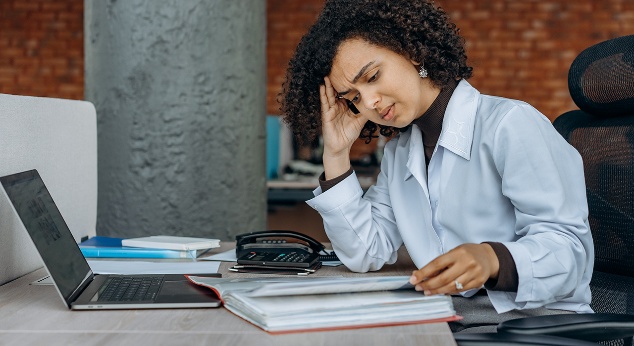 Stressed small business owner going through financial documents